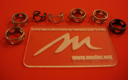 The various rings from Shapeways next to a Ponoko test card :)