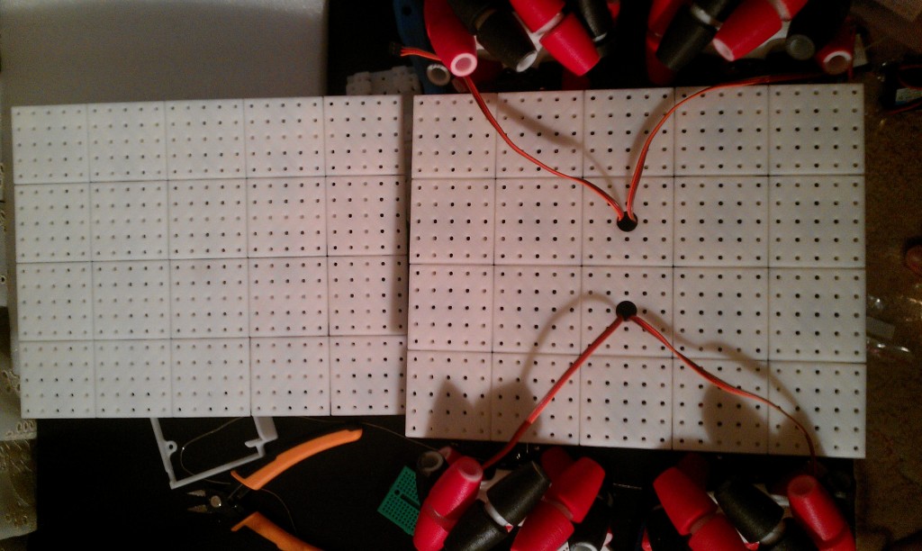 Top view of body with servo cable holes + old prototype in the back